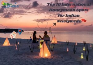 Romantic beach dinner setup at sunset with couple, lanterns, and travel-themed text for honeymoon spots for Indians.
