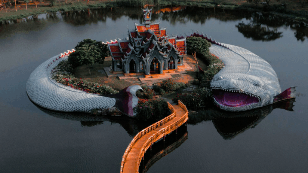 Temple island with giant serpent statue in Thailand – budget backpacking destination 2025