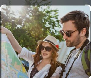 American travelers navigating India destinations with map after obtaining India visa for American citizens - tourism and sightseeing exploration"